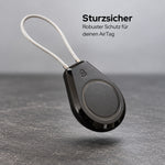 AirTag-Halter mit Stahlseil über einem Betonboden